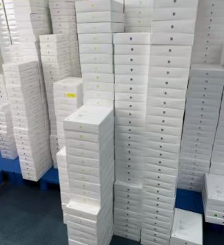 iPhone retail boxes stacked and ready to ship